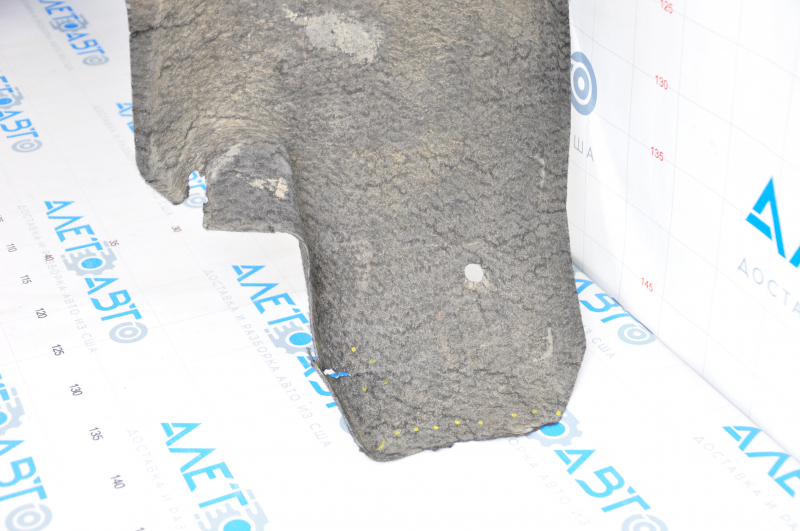 The rear right fender liner of a Toyota Camry v55 15-17 USA is torn.