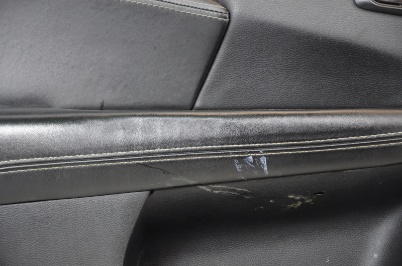 Door trim card front left Dodge Journey 11- black with black insert leather, armrest leather, gray stitching, dented armrest, scratches, needs cleaning