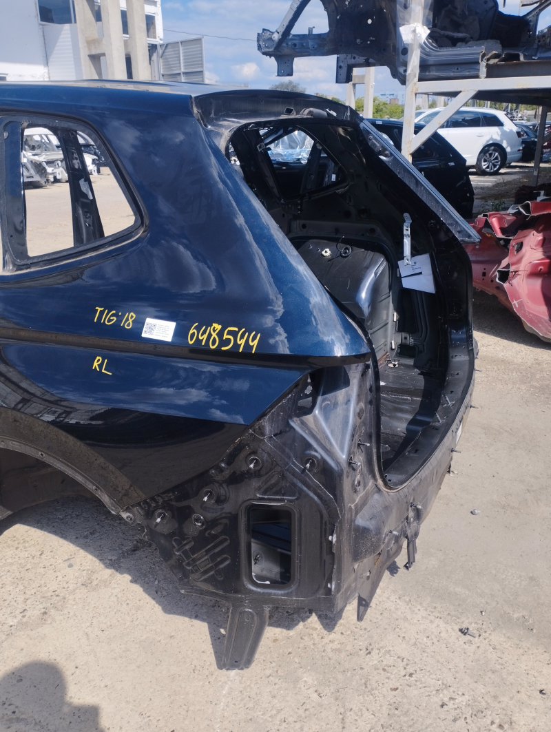 Quarter wing rear left VW Tiguan 18-long on the body, black, painted, pokes