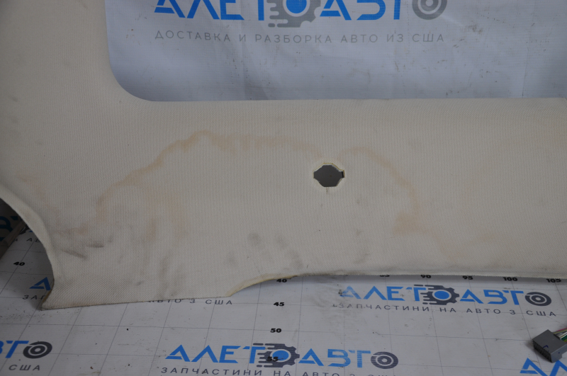 Tesla Model S 12-15 ceiling trim pre-restoration, under panorama, beige, under chemical treatment, tear of fastening, fabric peeled off