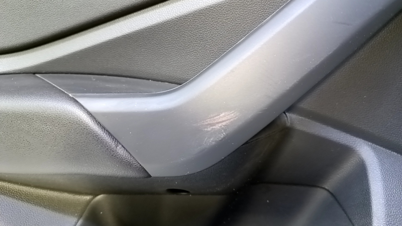 Door trim card rear left VW Jetta 19- black with black insert plastic, armrest black leather, scuffs, dent