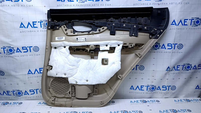 Door trim card rear left Nissan Rogue 14-20 beige with beige insert plastic, armrest beige leather, molding carbon glossy, scratches, abrasions, scuffs, dents