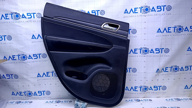Door trim card rear left Jeep Grand Cherokee WK2 14-16 black with black insert leather, armrest black leather, white stitching, molding with chrome, under mat black wood, pokes, scuffs, scratches, scu