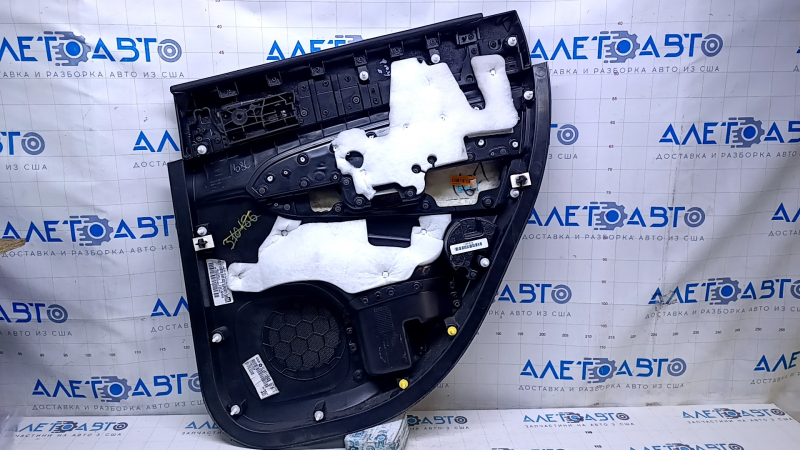 Door trim card rear left Jeep Grand Cherokee WK2 14-16 black with black insert leather, armrest black leather, white stitching, molding with chrome, under mat black wood, pokes, scuffs, scratches, scu
