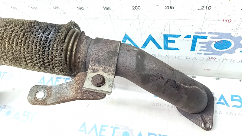 Jeep Renegade 15-15 2.4 exhaust pipe has a torn mesh and is rusty.