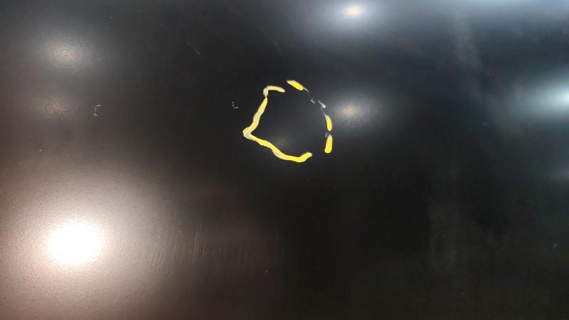 The front left door of a VW Passat b7 12-15 USA is bare and dented.