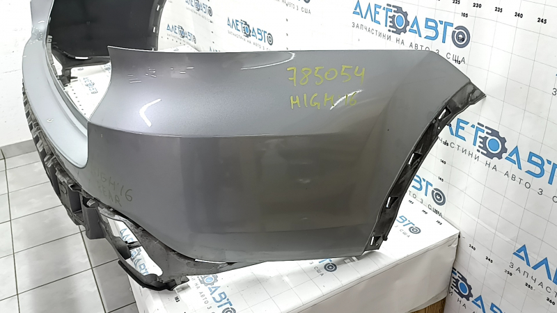 Bare rear bumper for a 19-20 Toyota Highlander without parking sensors, silver, dents, and scratches.