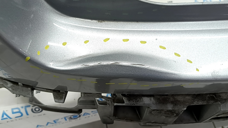 Bare rear bumper for a 19-20 Toyota Highlander without parking sensors, silver, dents, and scratches.