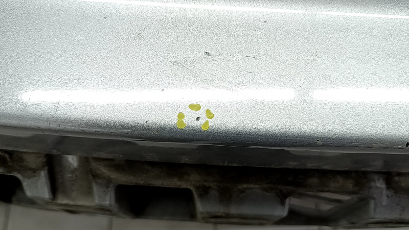Bare rear bumper for a 19-20 Toyota Highlander without parking sensors, silver, dents, and scratches.