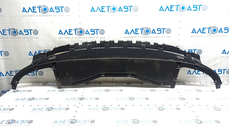 The front bumper center guard for Volkswagen ID.4 23-25 is worn and cracked.