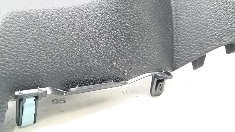 The dashboard cover under the start/stop button for a 19-22 Honda Insight is black and scratched.