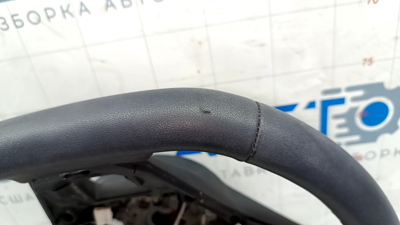 The steering wheel is bare, Volkswagen ID.4 23-25, black leather, heated, with scuffs.