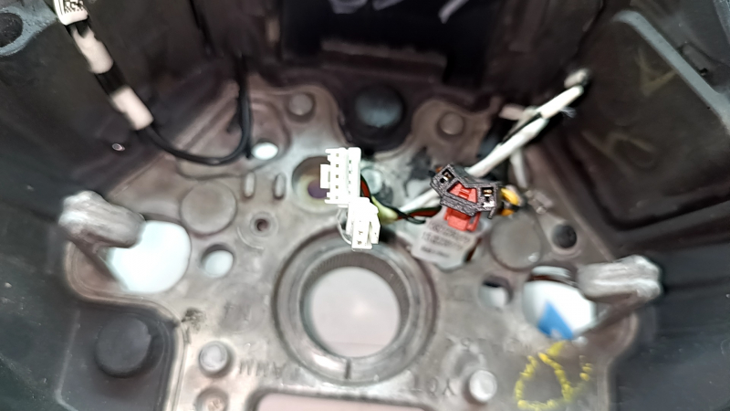 The steering wheel is bare, Volkswagen ID.4 23-25, black leather, heated, with scuffs.