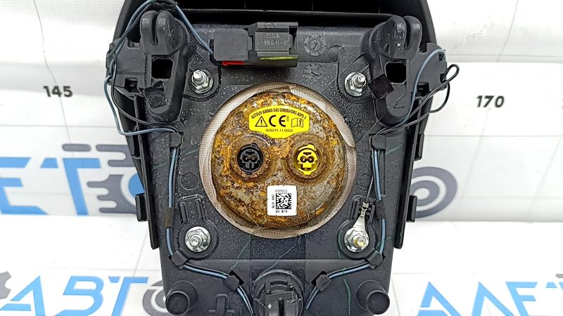 Black steering wheel airbag for the driver's side of a Ford Fusion mk5 17-20, dry-cleanable, rusty squib