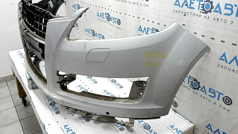 Bare front bumper for Audi Q7 4L 10-15 with parking sensors, white, dents, scratches, broken fasteners
