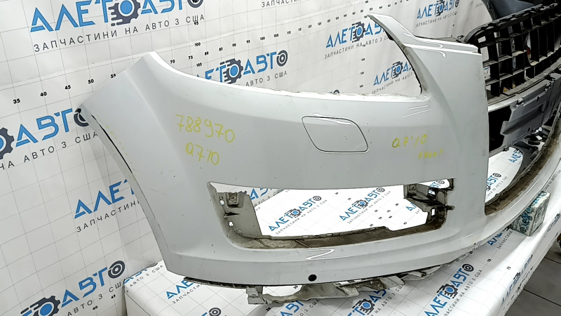 Bare front bumper for Audi Q7 4L 10-15 with parking sensors, white, dents, scratches, broken fasteners