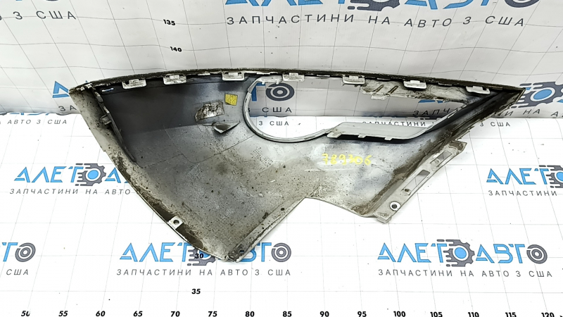 The front bumper trim under the fog light, left, Audi Q7 4L 10-15, is pressed, scratches
