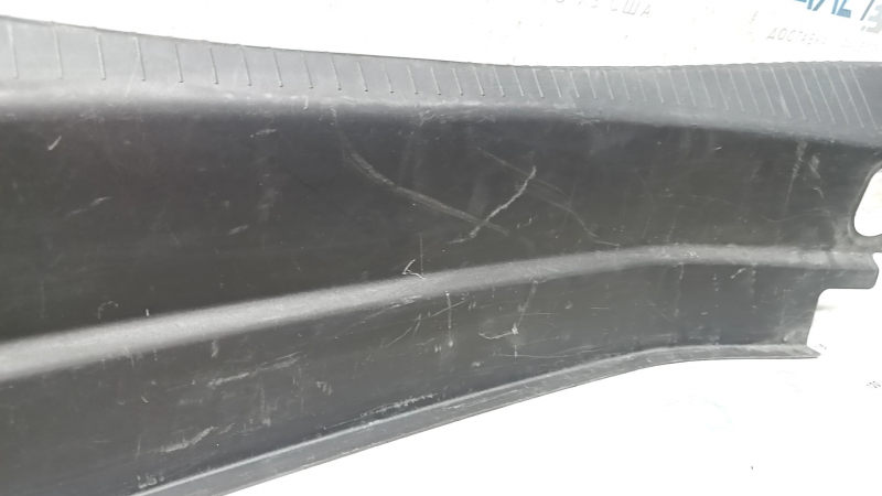 The trunk opening trim of the Cadillac CTS 14-19 is worn and scratched.