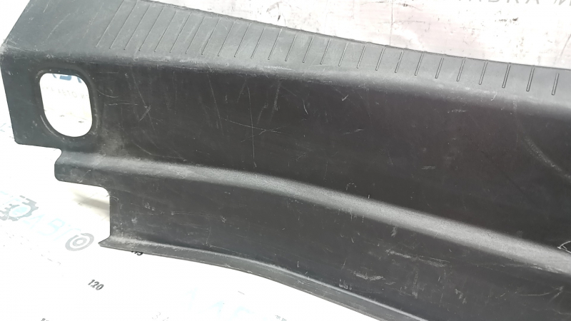 The trunk opening trim of the Cadillac CTS 14-19 is worn and scratched.