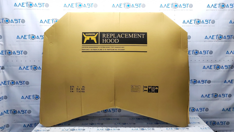 The hood of a Ford Fusion mk5 13-20 aluminum is bare, with dents on the edges.