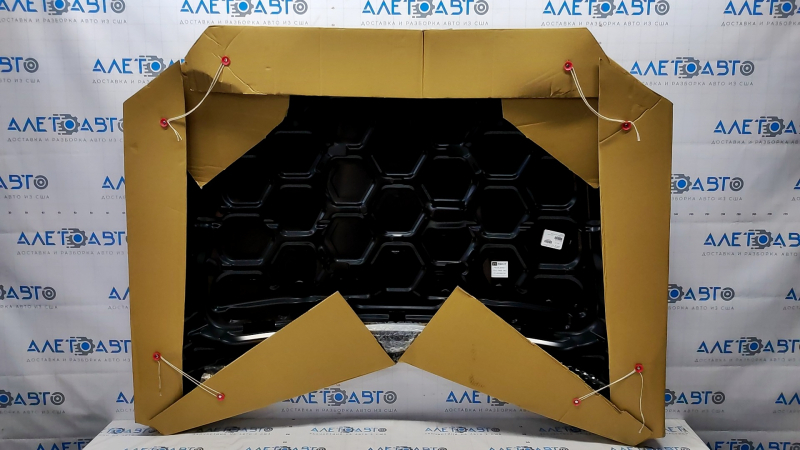 The hood of a Ford Fusion mk5 13-20 aluminum is bare, with dents on the edges.