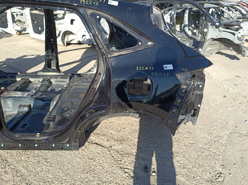 Quarter wing rear left Ford Escape MK4 20-24 on the body, black, pokes