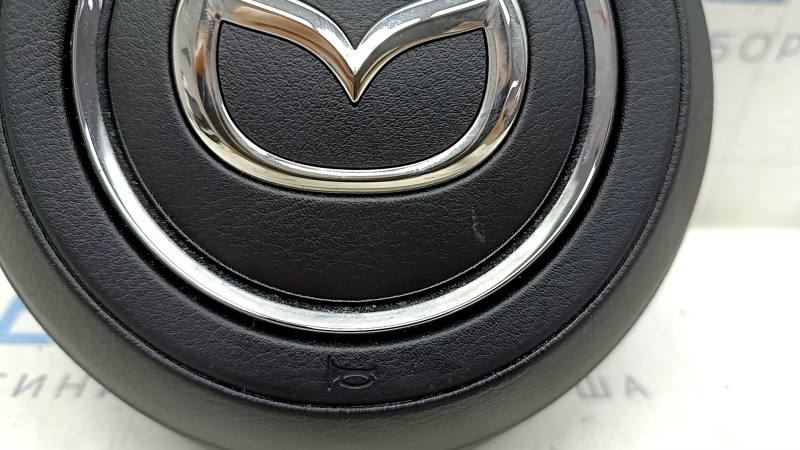 Mazda CX-5 19-25 black steering wheel airbag with chrome trim, scratches, rusty piston