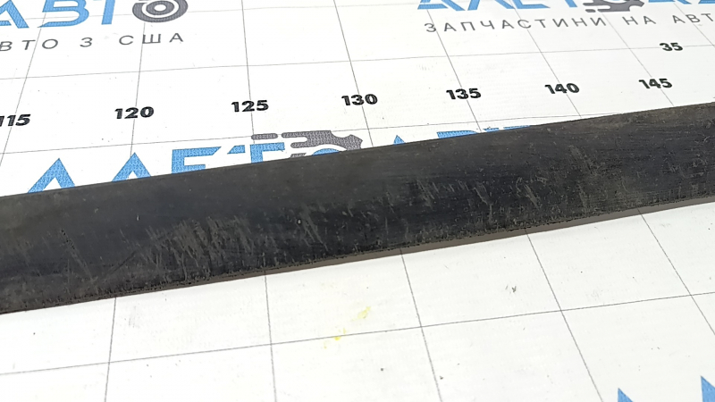 The front bumper lip of a 1993 Honda Accord is worn.