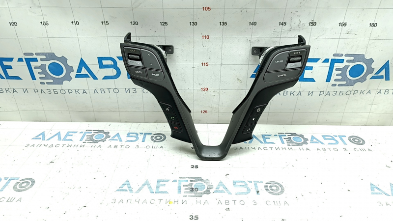 The steering wheel controls on a Hyundai Santa FE Sport 2017-2018 restyling have worn trim and broken fasteners.