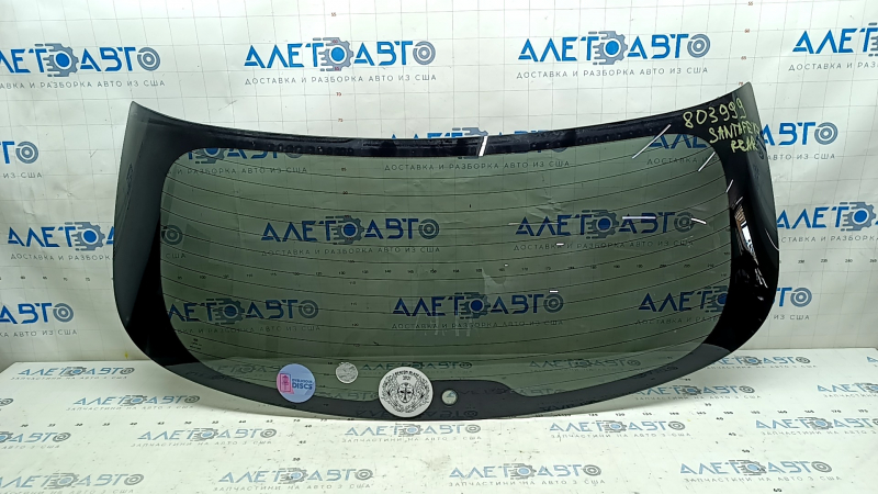Rear glass for the trunk door of a Hyundai Santa FE Sport 17-18 rest.