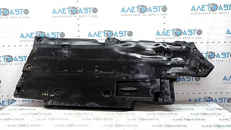 The left underbody protection of a Toyota Camry v70 18-24 is torn.