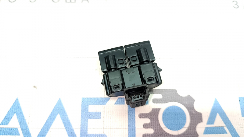 Central lock button for the front right door of a Nissan Ariya 23-25