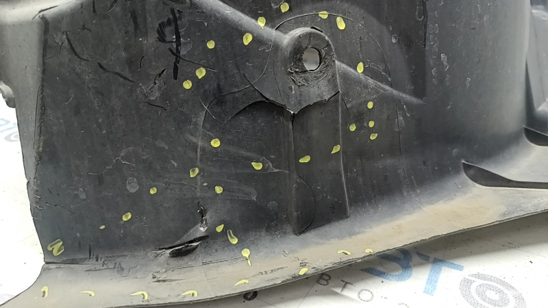 The front right fender liner of a Volvo XC90 16-23 is torn, non-factory holes