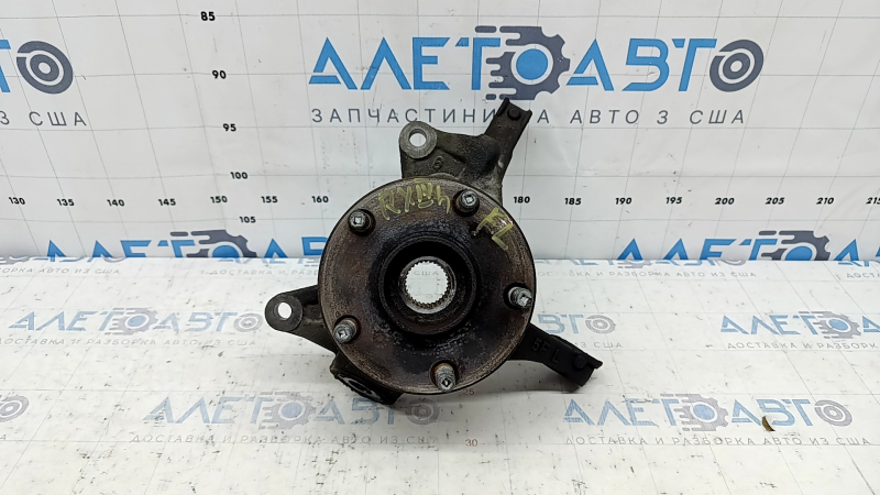The front left axle with hub for a Lexus RX350 RX450h 10-15 is rusty and wedge-shaped.