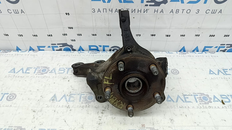 The front left axle with hub for a Lexus RX350 RX450h 10-15 is rusty and wedge-shaped.
