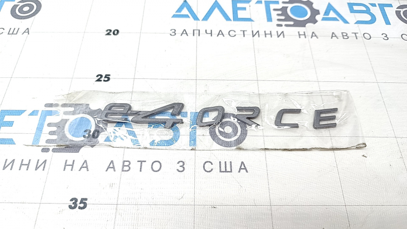 The E-4ORCE emblem is on the tailgate of the Nissan Ariya 23-25.