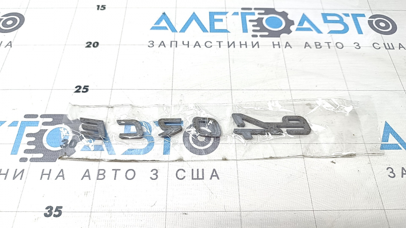 The E-4ORCE emblem is on the tailgate of the Nissan Ariya 23-25.