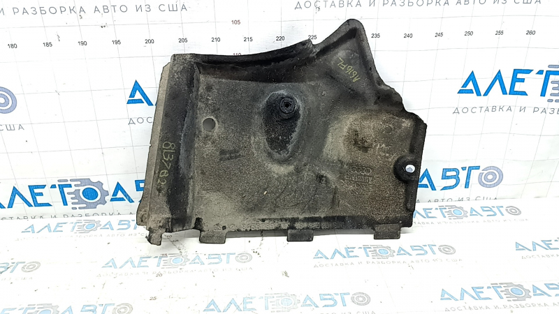 The front left underbody protection of the Audi A6 C7 12-18 is worn and dented.