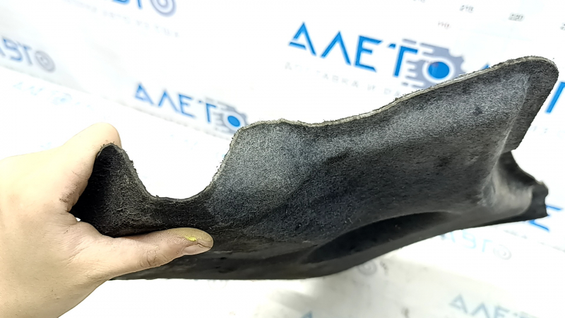 The front left underbody protection of the Audi A6 C7 12-18 is worn and dented.
