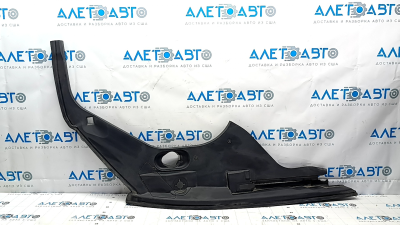 The left underhood trunk trim of the 2021-23 Ford Mustang Mach-E is worn.