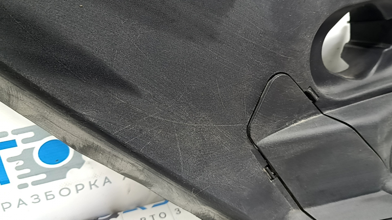 The left underhood trunk trim of the 2021-23 Ford Mustang Mach-E is worn.