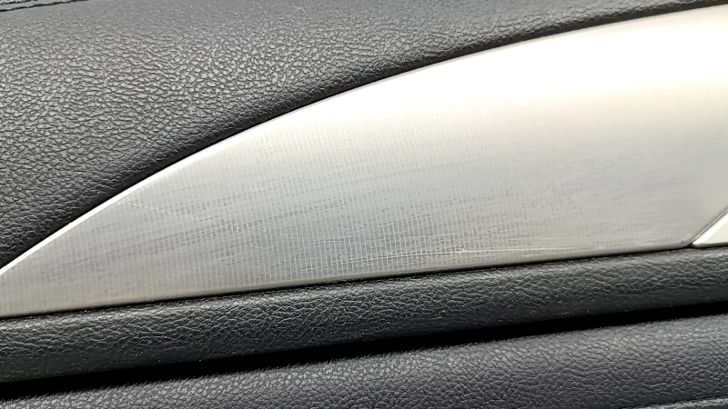 Black rear left door panel for a 17-20 Lincoln MKZ, with leather insert, black leather armrest, under tweeter, under speaker, with chrome molding, dent, scratches on molding