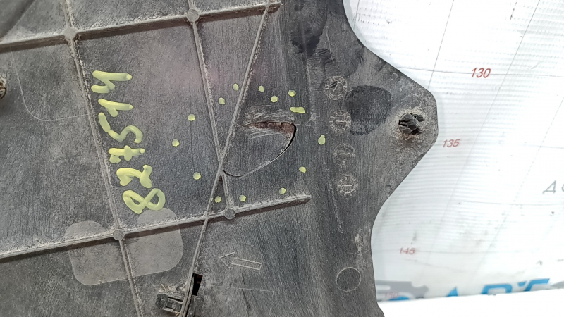The front left fender liner of the Mazda CX-30 20-23 is worn and broken.