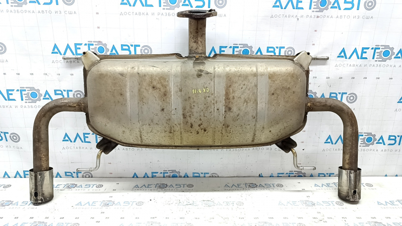 The rear muffler with barrels of a Mazda CX-9 16-23 is rusty, the insert is sawed off, the tip is dented