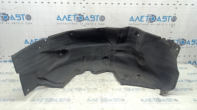 The rear left fender liner of a Toyota Sienna 21-24 is dented and torn.