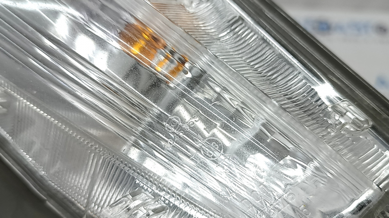 Left turn signal for a 1992 Toyota Prius V, sand, crack in the glass.