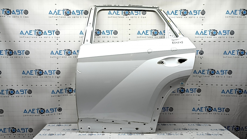 The bare rear left door of a Hyundai Tucson 22-24 white TW3, dents