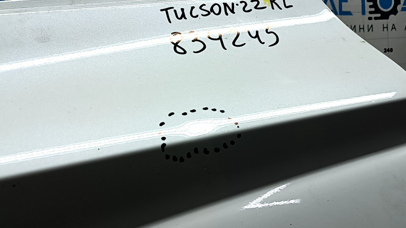 The bare rear left door of a Hyundai Tucson 22-24 white TW3, dents