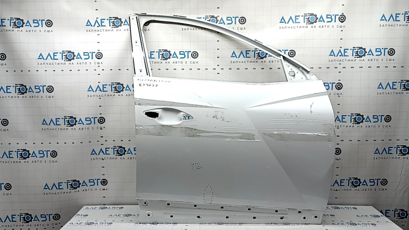 The bare front right door of a Hyundai Tucson 22-24 white TW3, dent, bump