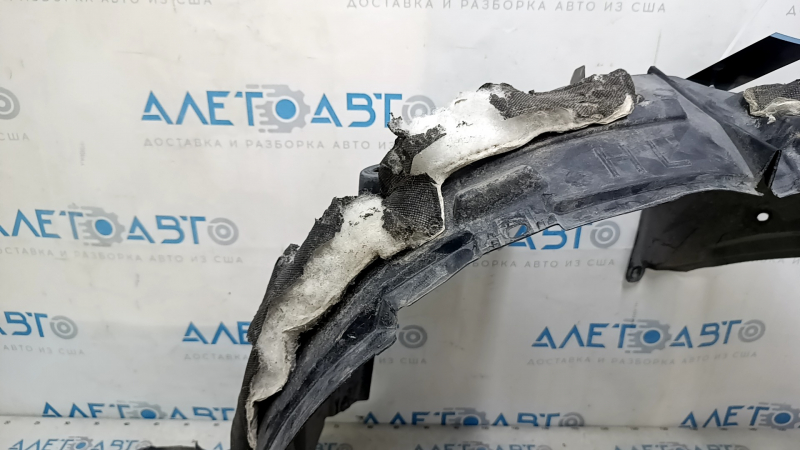 The front left fender liner of a Nissan Rogue 14-20 is broken and the sound insulation is torn.